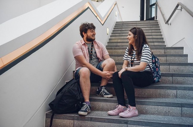 Photos of students sitting on steps
