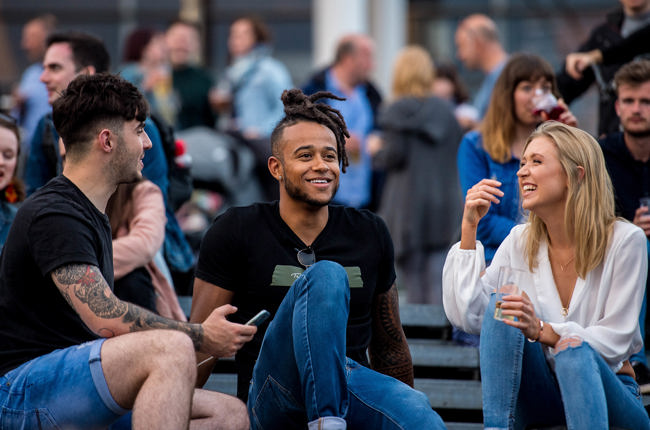 Three people chatting and laughing