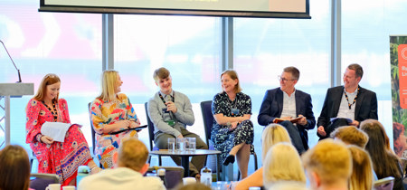 A group of panelists at the conference  