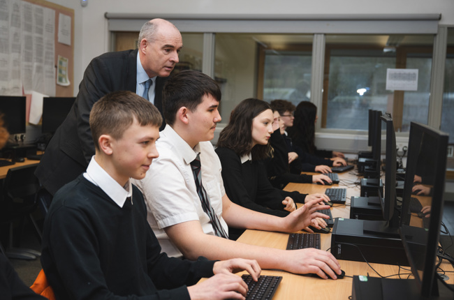 Young people by desks