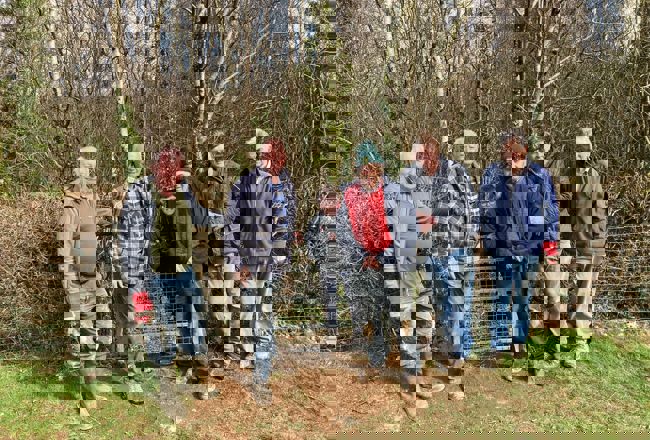 Volunteers from Ramblers Cymru standing in a field