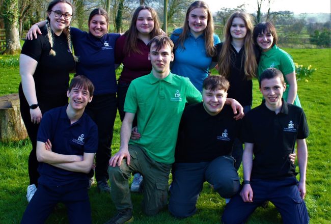 Participants of The Duke of Edinburgh Award standing in a field