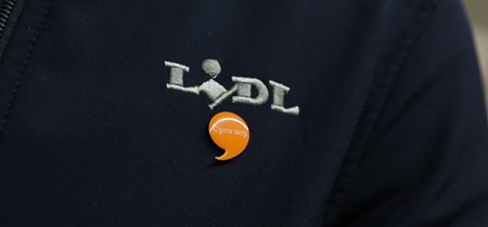 Jacket with Lidl logo and Iaith Gwaith badge 