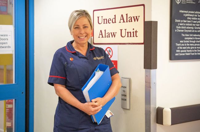 Nurse holding a blue folder